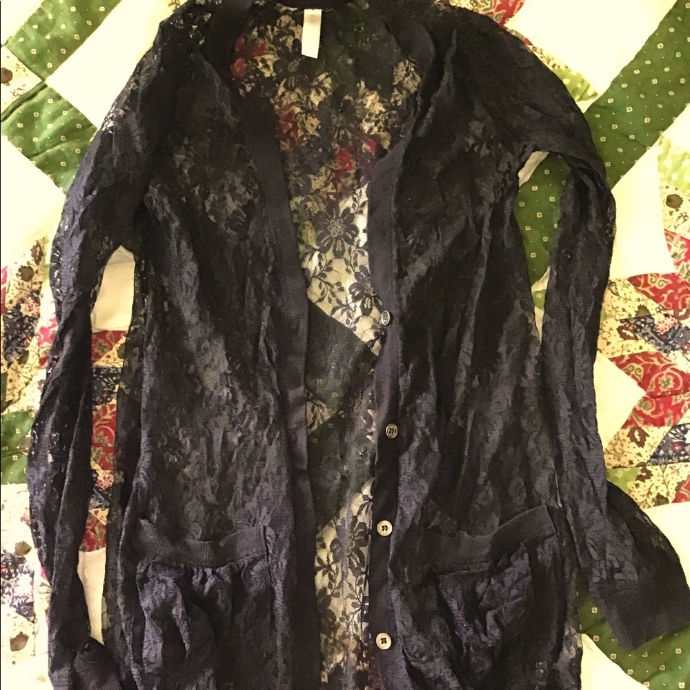 Cute black lace cardigan with pockets.
